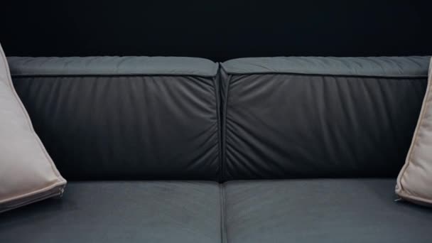 Black Sofa Beige Cushions Filmed Slowly Black Background Video — Video Stock