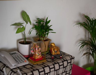 a cup of tea and a vase with a candle on a white background
