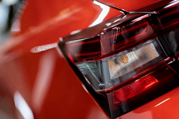 close-up of a red led taillight on a modern car, detail on the rear light of a car