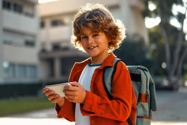 Back School Cute Kid Stylish Hairstyle Backpack Holding Mobile Phone — Stock Photo, Image