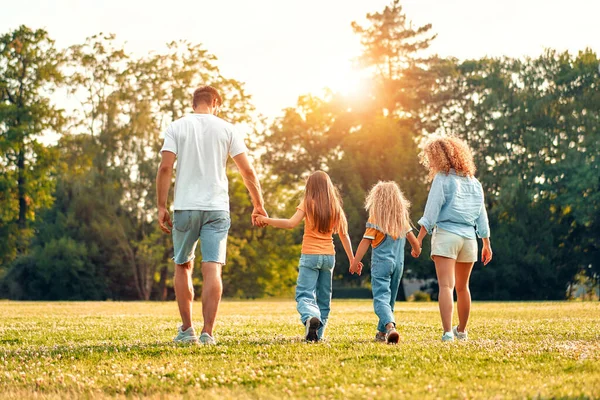 Happy Young Family Dad Mom Two Children Sisters Walking Running — Stock Photo, Image