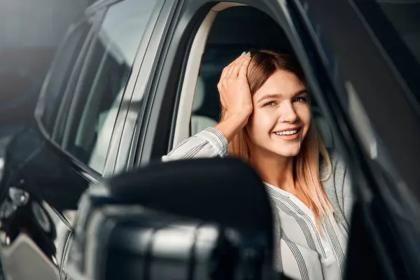 Woman Sitting New Car Car Dealership Rejoicing Purchase Purchase Rental — Stock Photo, Image