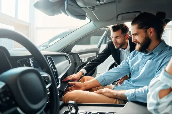 Couple Sitting Car Car Dealership Receiving Advice Salesperson Purchase Rental — Stock Photo, Image