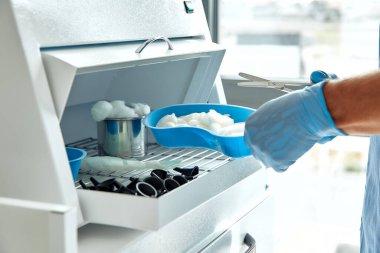 In a wellorganized workspace, a skilled medical professional in gloves prepares lab samples meticulously to ensure precise results in analysis and diagnosis processes essential in healthcare clipart