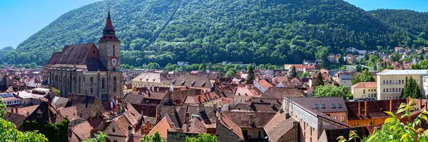 stock image panoramic view across the city of Brasov (Kronstadt) in Transsylvania with the black church from the so called 