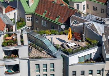 view from a former flaktower onto modern residential buildings with roof gardens at the Viennese district of Mariahilf, Austria clipart