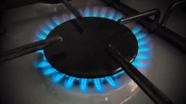 Close-up footage of fire burner on gas kitchen stove