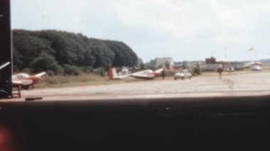 Vintage view from a distance of an Air Activity Centre in the UK, featuring parked aircraft in 1970.