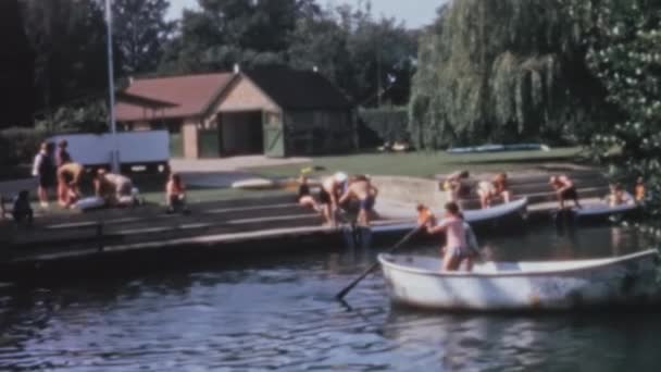 Group Young Boys Paddling Canoe Serene River Surrounded Lush Green — Video