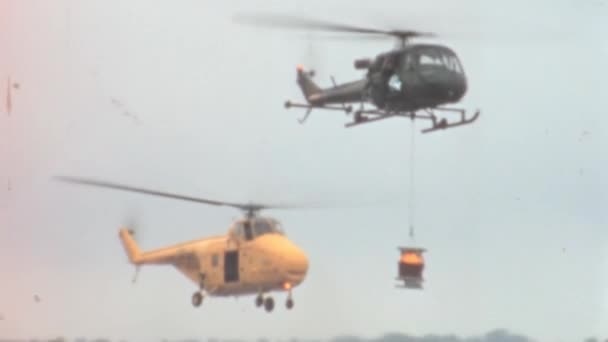 British Royal Air Force Military Helicopter Flying Load Suspended Center — Stock video