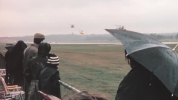 Spectators 1970S Airshow Watch Display Military Helicopters Rain Westland Wessex — Stock video
