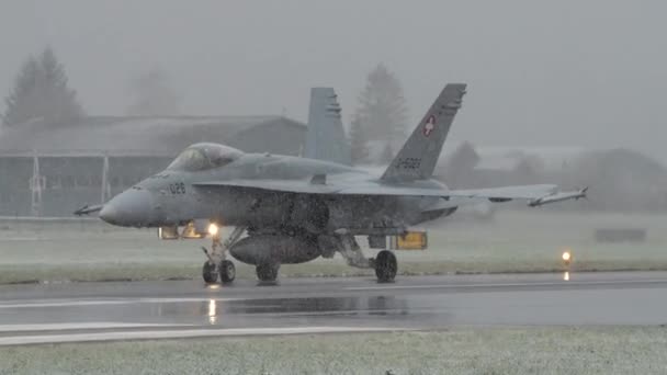 Fighter Jets Taxi Wet Runway Reflecting Its Lights Snowfall Cars — Stockvideo