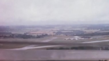 Aerial view of the English countryside from the window of a vintage glider in a rare historical film. Slingsby T.21 open cockpit, side by side two-seat glider of Royal Air Force Gliding and Soaring