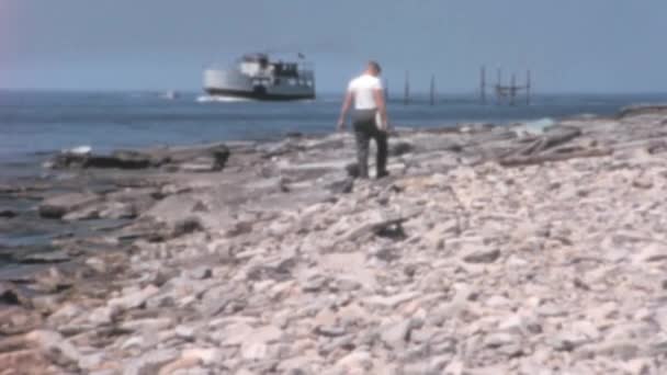 American Adult Caucasian Man Walking Rocky Beach Calm Relaxing Lake — Vídeo de Stock