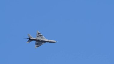 Pula Croatia March 23 2024: Mig-21 fishbed of the croatian air force soaring through clear blue skies, ample copy space clipart
