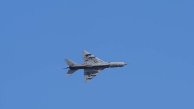 Pula Croatia March 23 2024: Side view of a mikoyan gurevich mig-21 fishbed jet, part of the croatian air force, soaring in a clear blue sky clipart