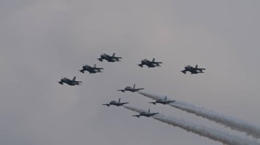 Istrana Italy April 5 2024: Fighter Jet Airplanes Formation During a Military Parade. AMX Ghibli of Italian Air Force. NATO Power and Strength. Copy Space clipart