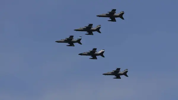 stock image Istrana Italy April 5 2024: Fighter Jet Airplanes Formation During a Military Parade. AMX Ghibli of Italian Air Force. NATO Power and Strength. Copy Space