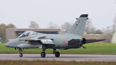 Istrana Italy April 5 2024: Combat Aircraft Landing on NATO Military Airport. Side View Close Up. AMX Ghibli of Italian Air Force. Copy Space clipart