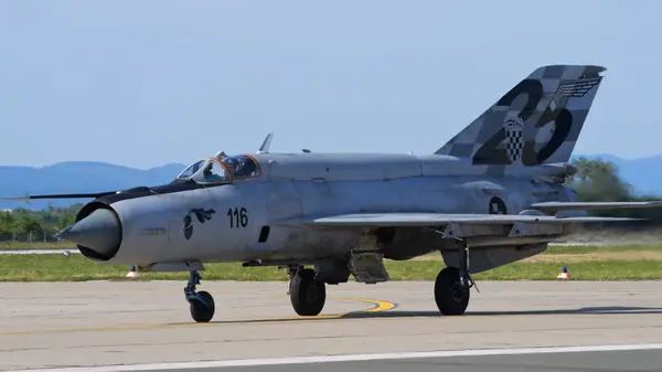 stock image Zagreb Croatia May 11 2024: Soviet-era combat aircraft MiG21 taxiing on runway. Copy Space. Mikoyan Gurevich MiG-21 Fishbed of Croatian Air Force.