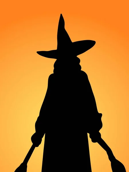 オレンジの背景に黒い魔女の形 — ストック写真