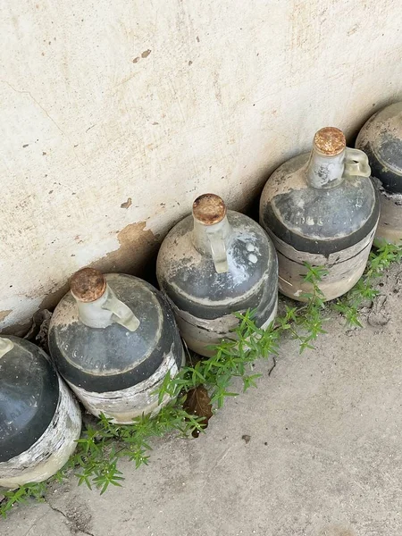 old dirty clay pots on the street