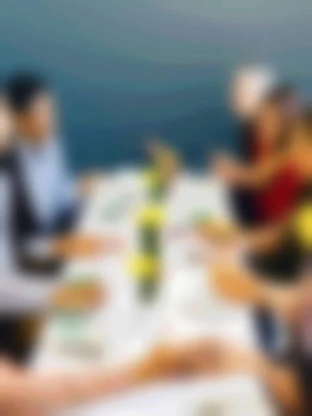 blur of people in meeting room for background