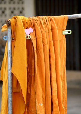 close up yellow robe hanging