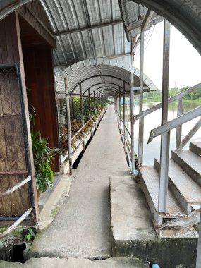 old wooden bridge in the park at chochonegsao Thailand