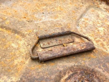 old rusty metal plate on the background of the house