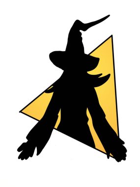 silhouette of a witch in a black dress