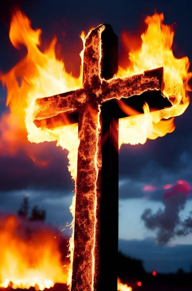 a closeup shot of a fire burning cross