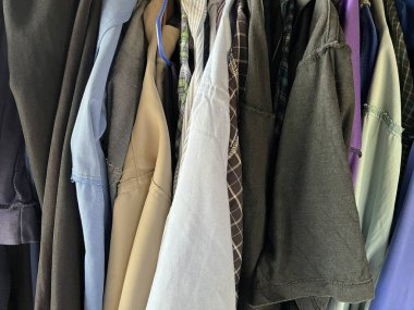 different types of clothes in a row 