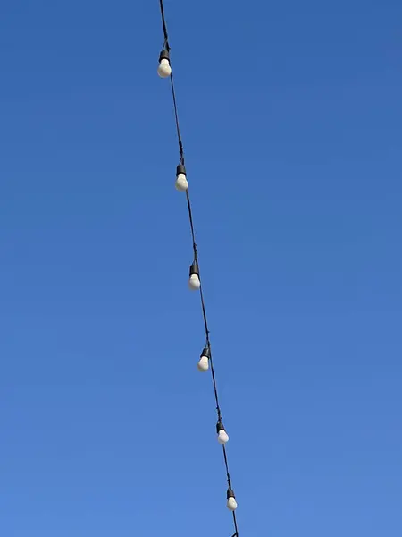 String Lights Blue Sky Background — Stock Photo, Image