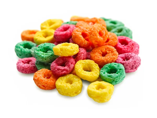 pile of colorful cereal rings isolated on white background