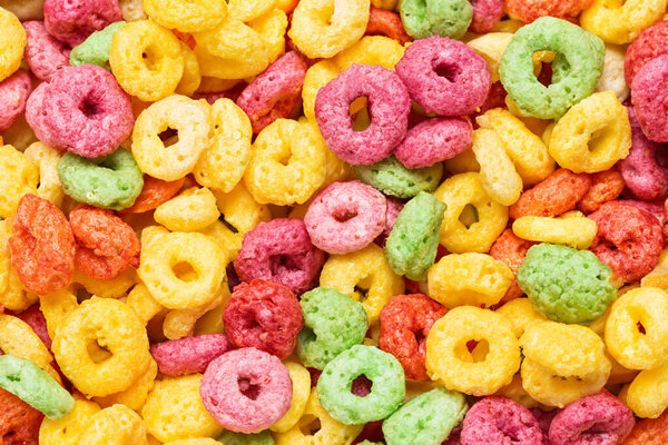 colorful tasty cereal as background, top view