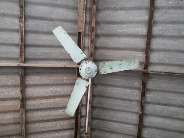 old fan on ceiling with roof