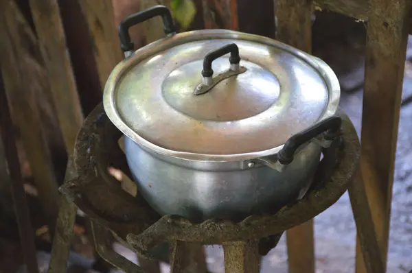 old rusty iron pot for cooking