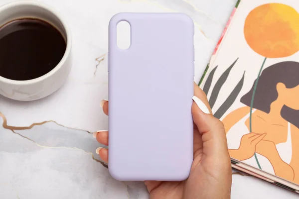 stock image Colorful phone case on a marble look floor. E-commerce product image.