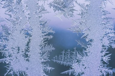 Cam, arkaplan dokusu üzerindeki soyut buz deseni.