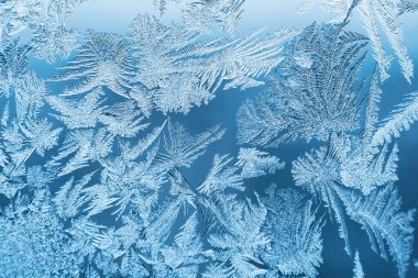 Cam, arkaplan dokusu üzerindeki soyut buz deseni.