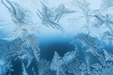 Cam, arkaplan dokusu üzerindeki soyut buz deseni.