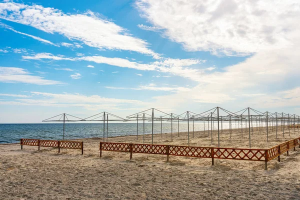 Stock image Frame of beach umbrellas on a deserted sea beach.