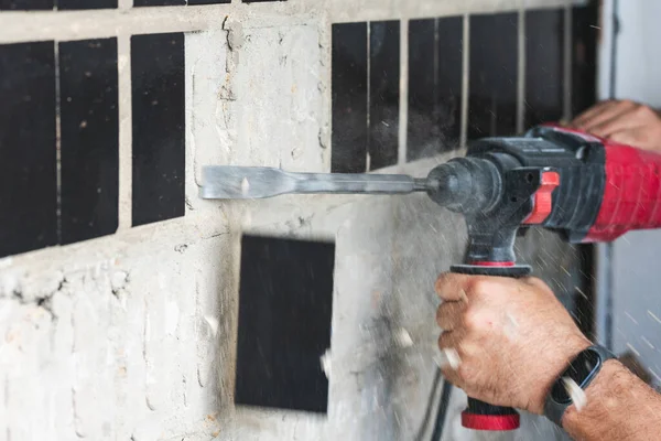 Builder Puncher Dismantles Old Tiles Concrete Wall Stockfoto