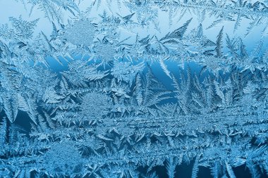 Cam, arkaplan dokusu üzerindeki soyut buz deseni.