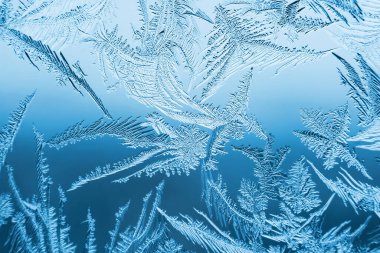 Cam, arkaplan dokusu üzerindeki soyut buz deseni.