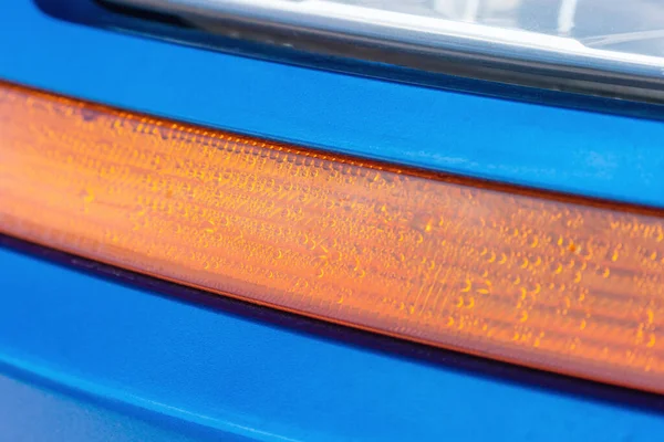 Water condensation in a car\'s turn signal headlight.