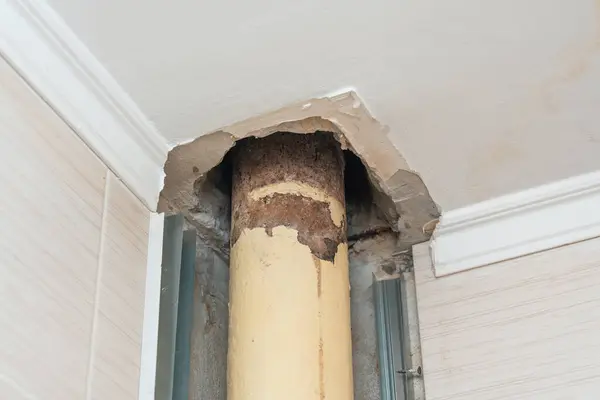 Old leaking sewer pipe in a residential building. Replacing the sewer system in an apartment.