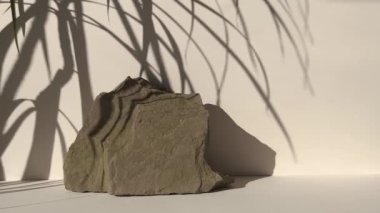 Stone Podium for promotion on beige Background. Natural pedestal. Podiums with leaf shadow. Beauty product mockup.Front View. 