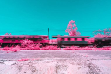 Infrared photography, trains in motion, captured in a vibrant color scheme with dominant shades of turquoise and pink. The background includes trees and power lines clipart